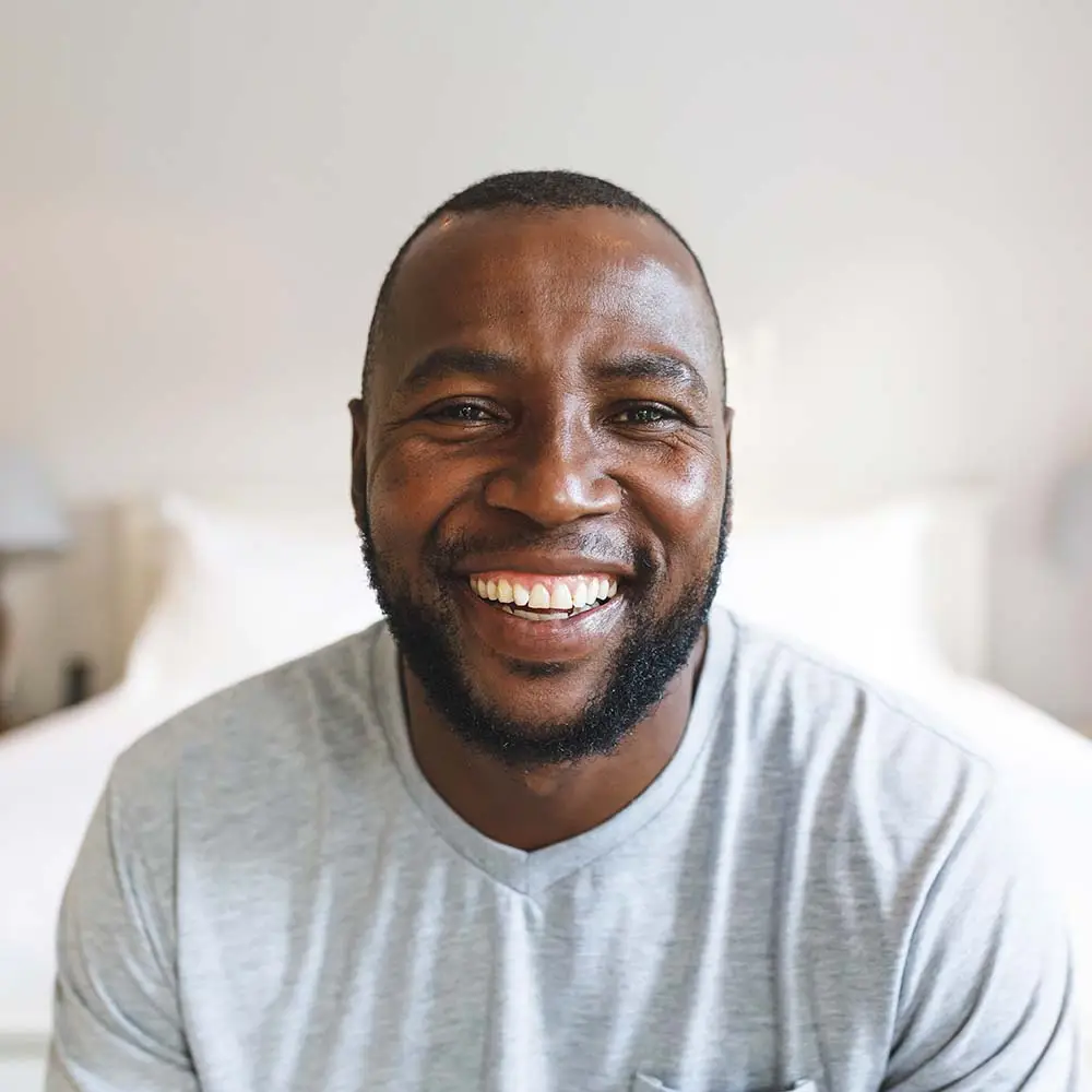 portrait-of-happy-african-american-man-looking-at-KY33EHT.jpg
